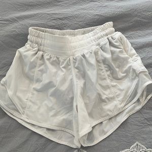 LULULEMON white low inch high low rise hotty hot shorts. Easily able to move in.